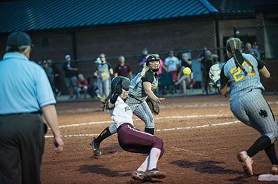 Abby Fannin tosses the ball over to Alaina Castle